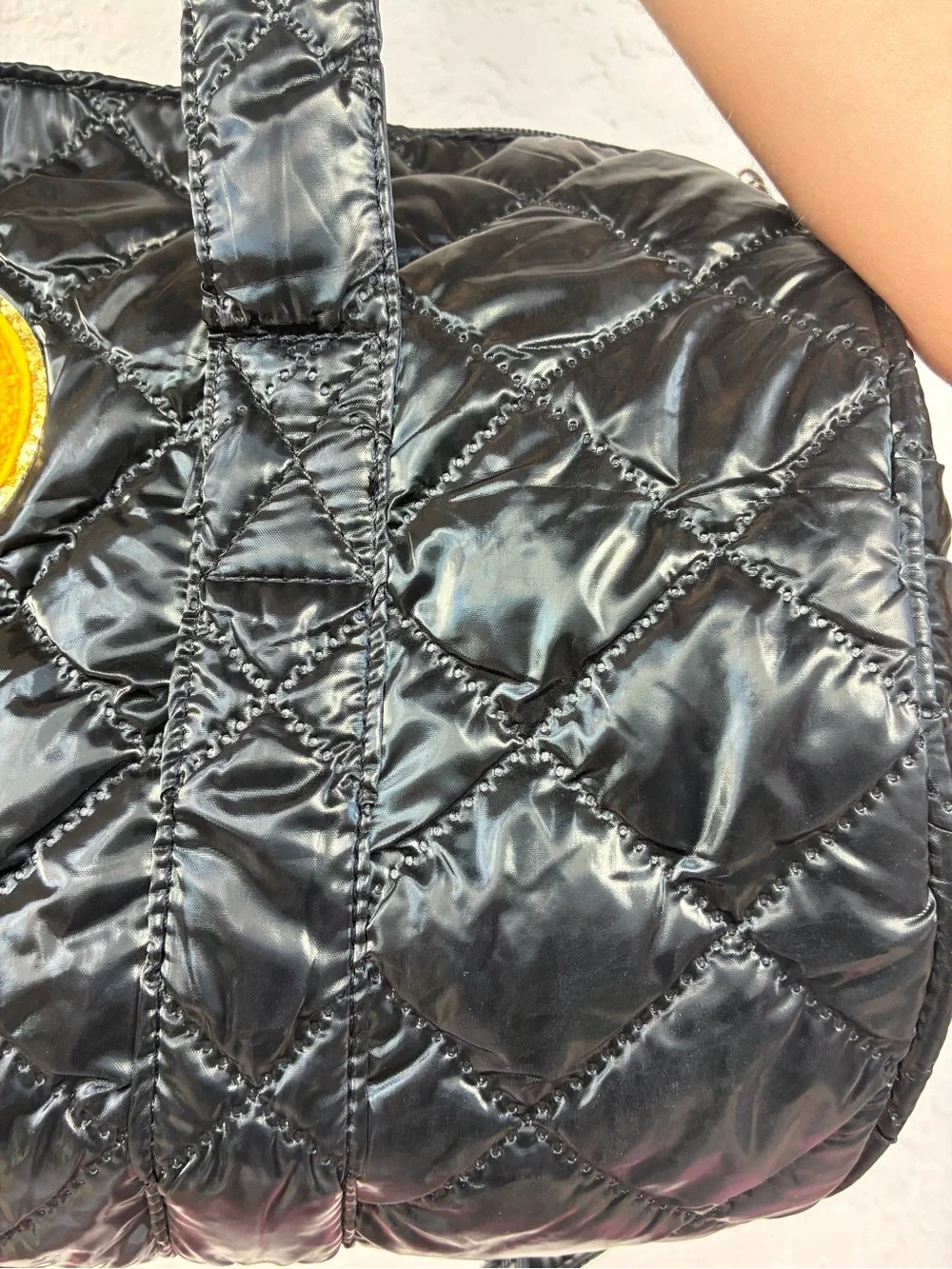 Black Quilted Duffel Bag with Smiley Patch